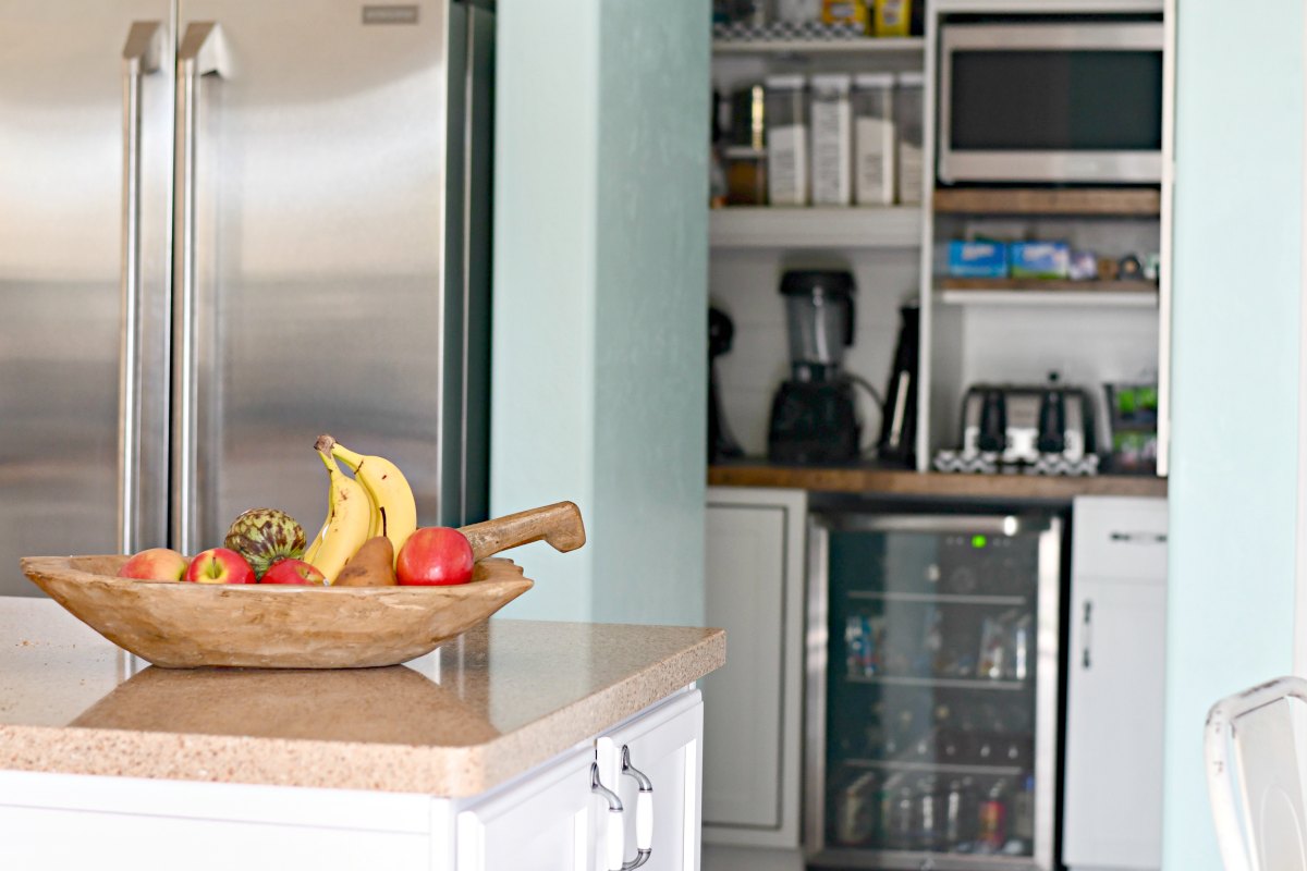 the inside of the reorganized walk-in pantry from the kitchen