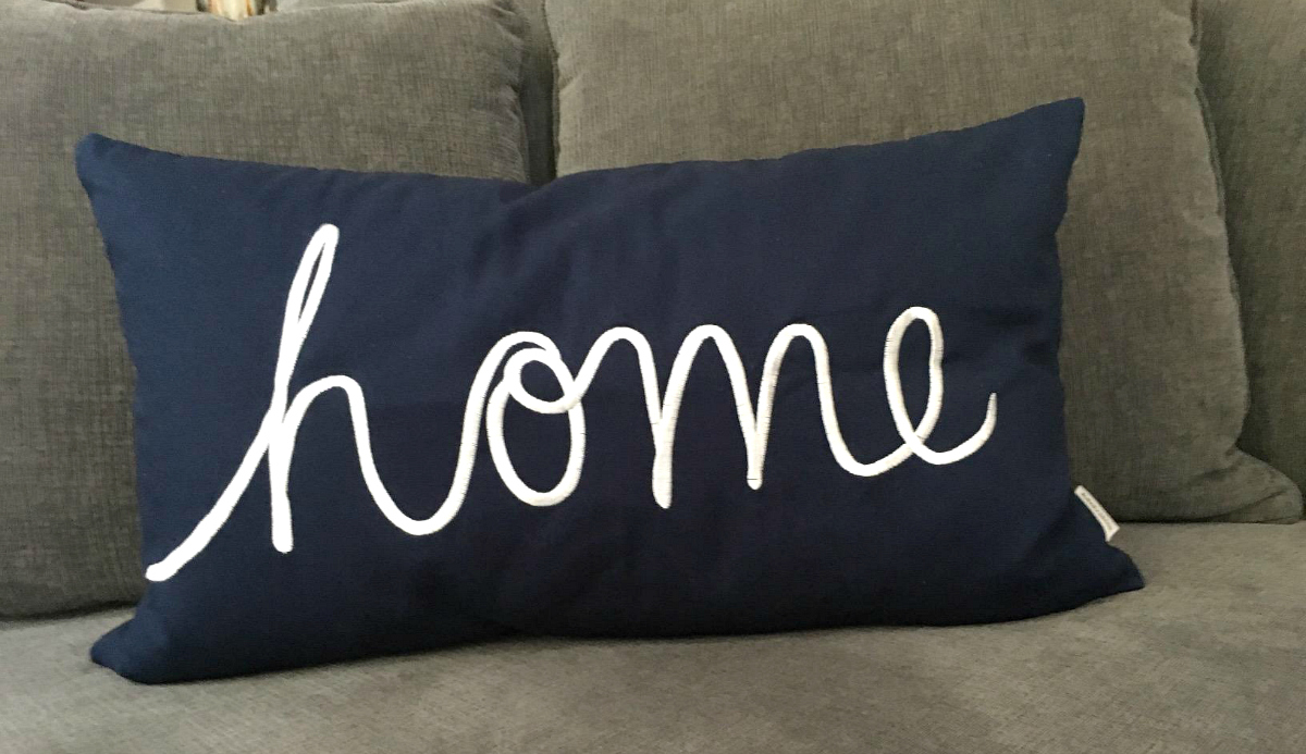 Pillow that reads "home"