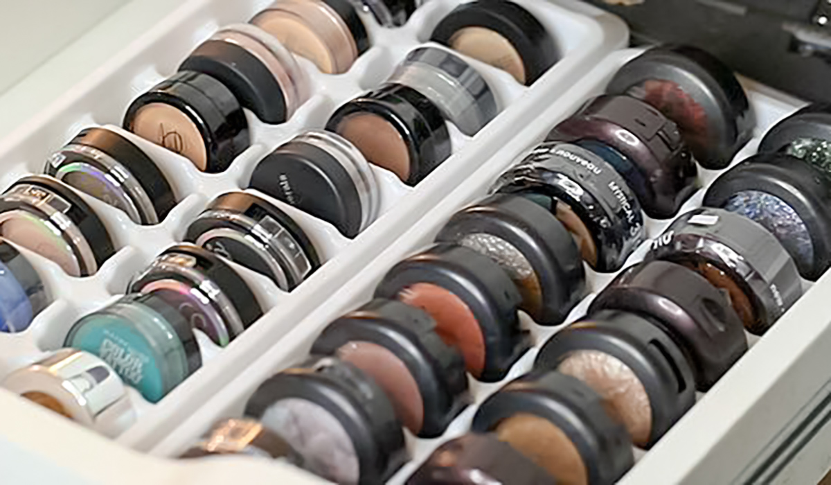 ice cube tray with small eye shadow pods in cube sections