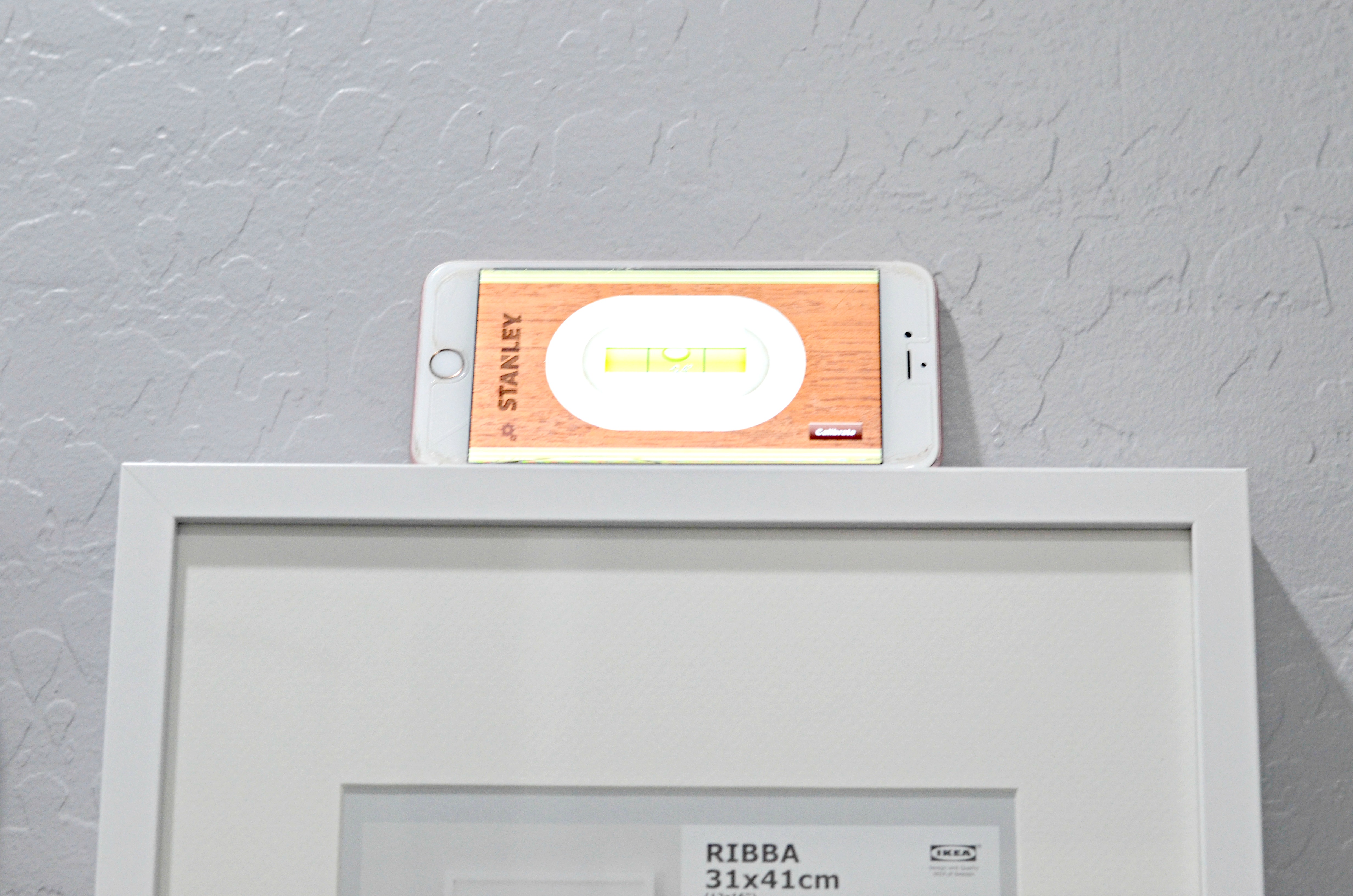 cell phone being used as a leveling tool 