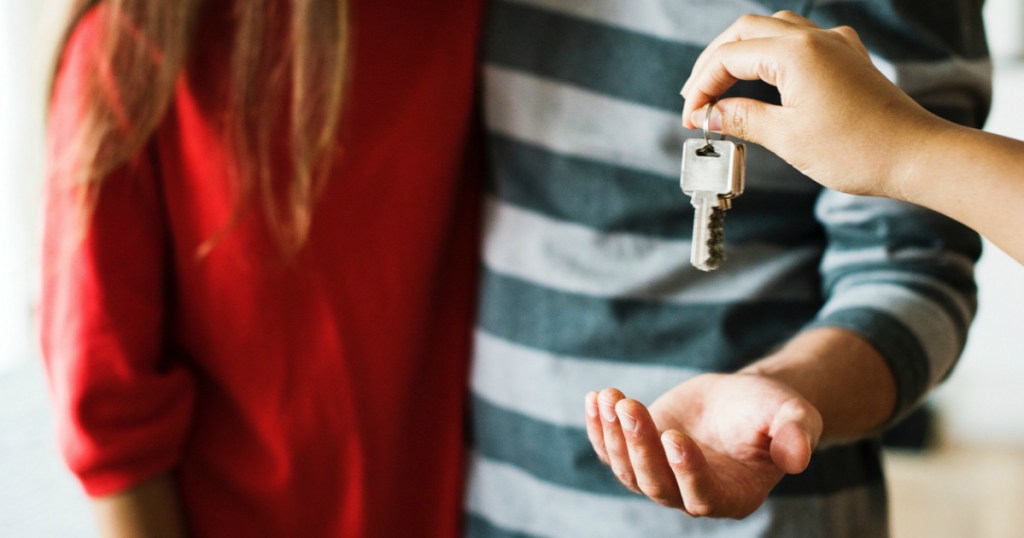 couple holding new home keys