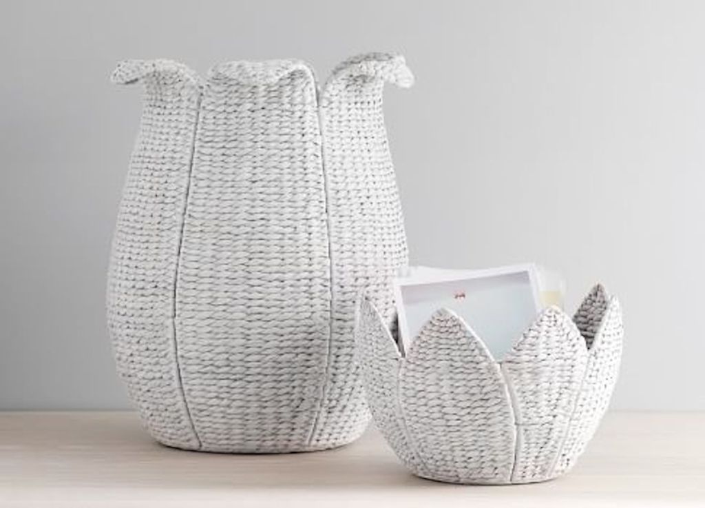 white washed woven flower baskets sitting next to each other on the floor