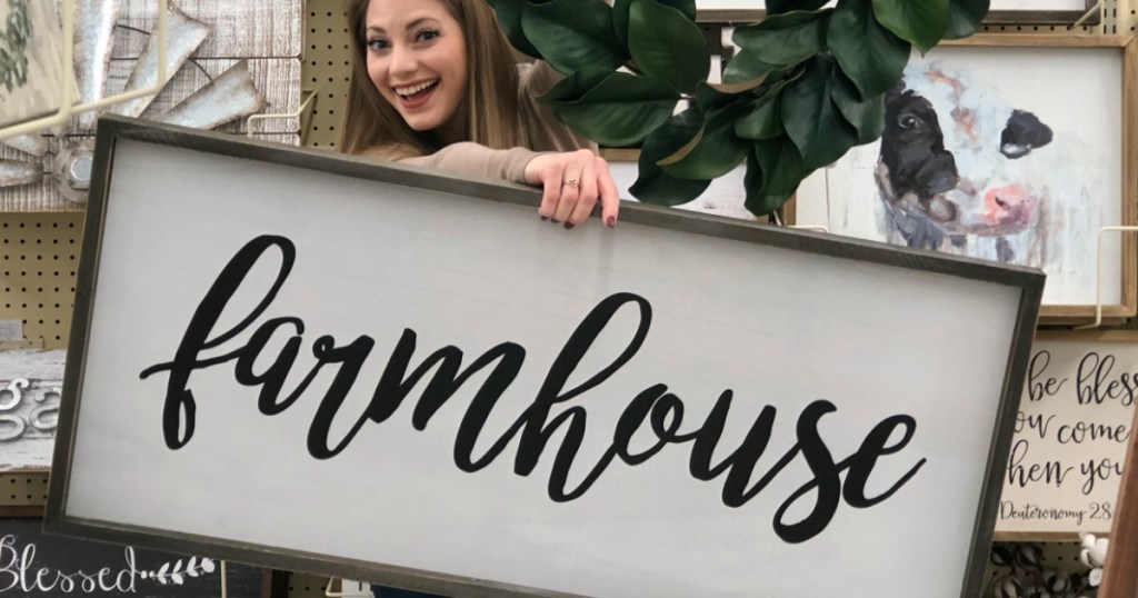 Sara holding large farmnhouse sign at Hobby Lobby 