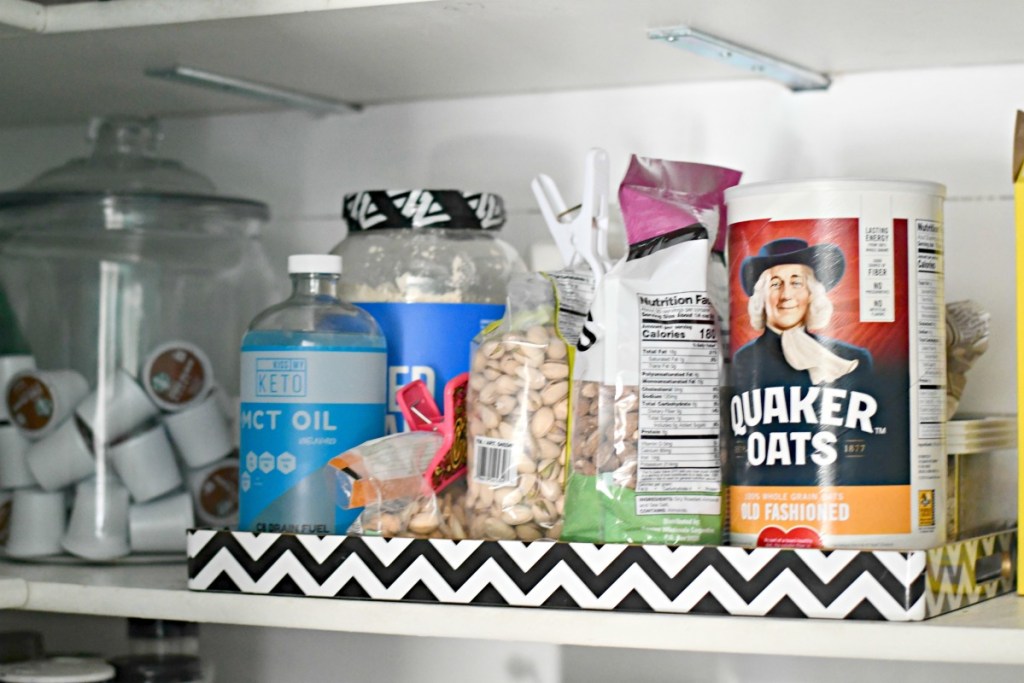 organizing using trays in the pantry 