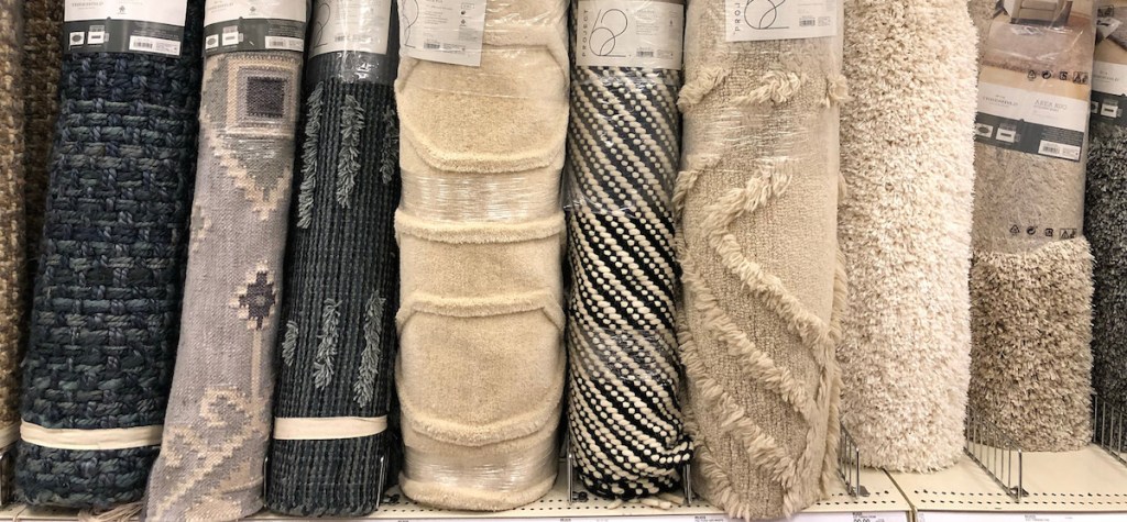 a line of difference neutral colored rugs from blue gray black white beige cream colored