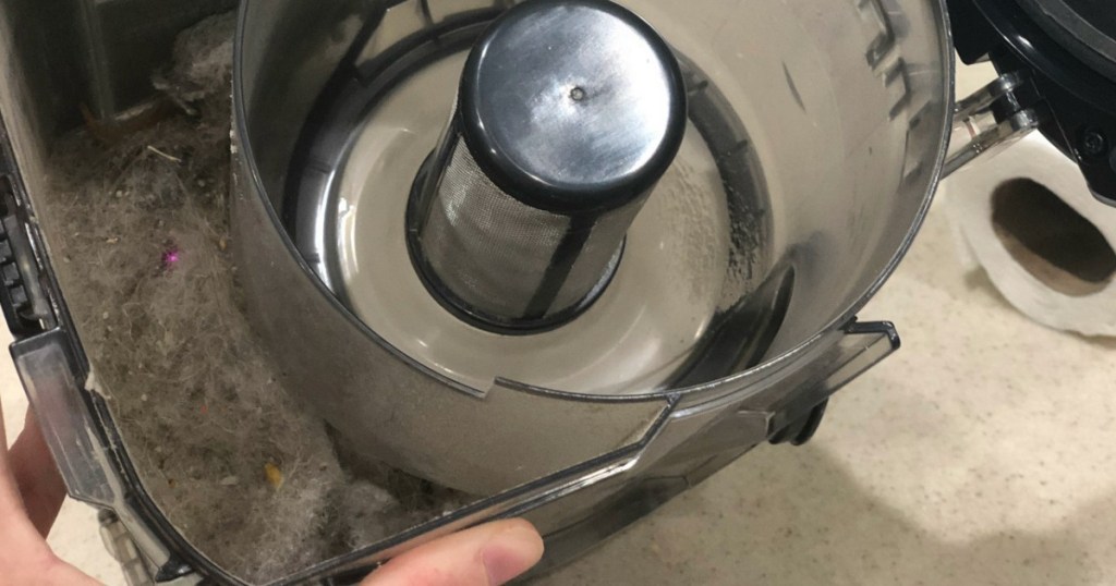 Bagless Vacuum Canister Filled with Dirt 