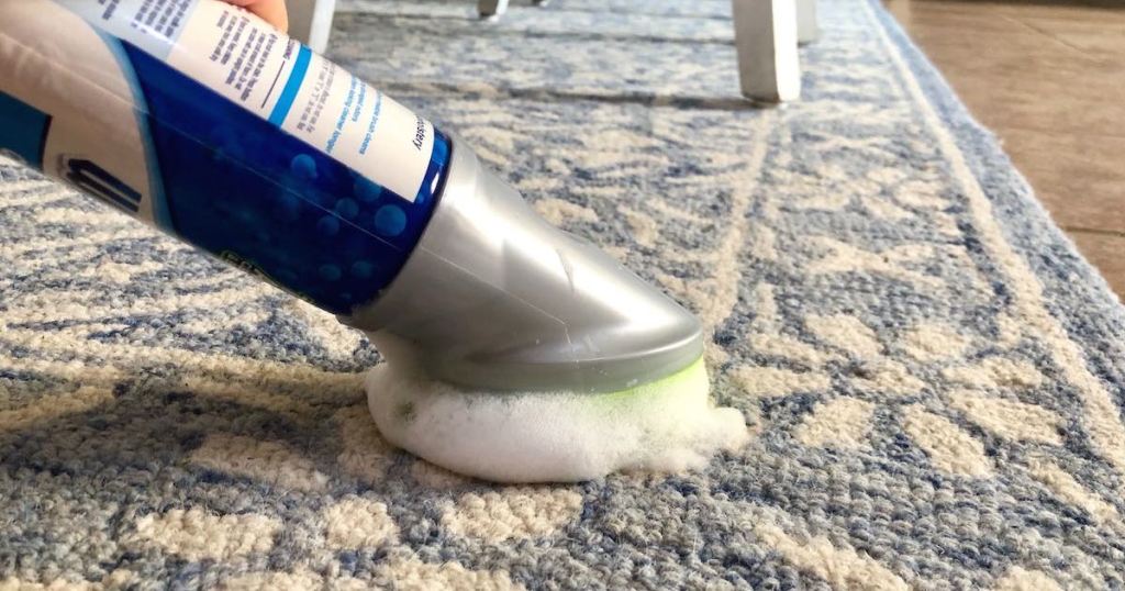 can of foaming carpet cleaning scrubbing blue and cream floral area rug