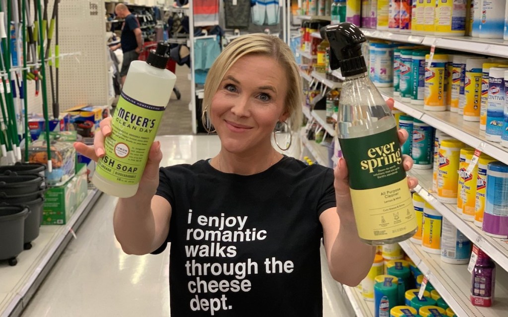 collin holding two cleaning products in store cleaning aisle 