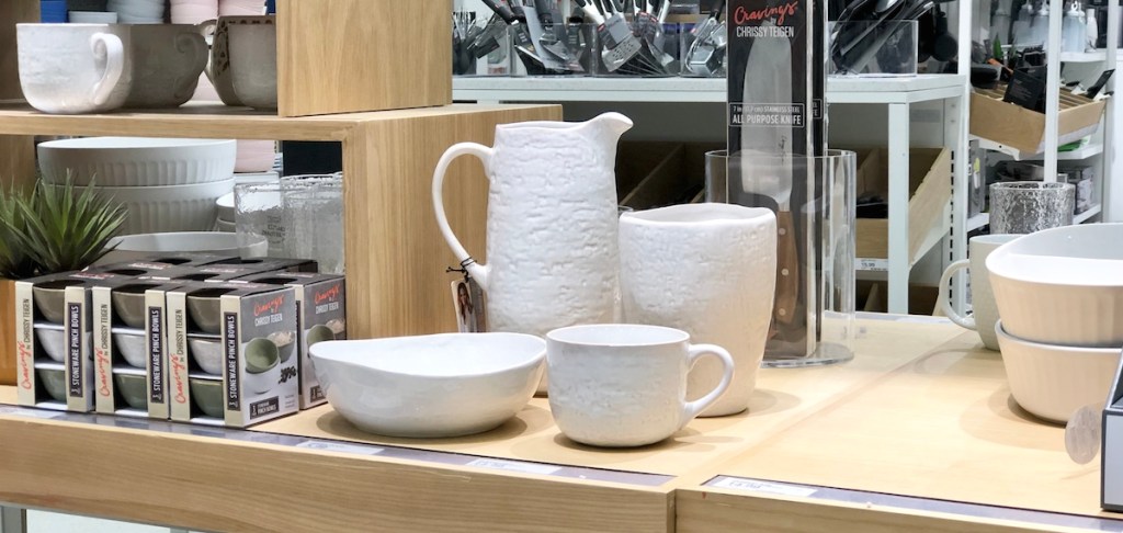 white serving dishes on a store shelf 