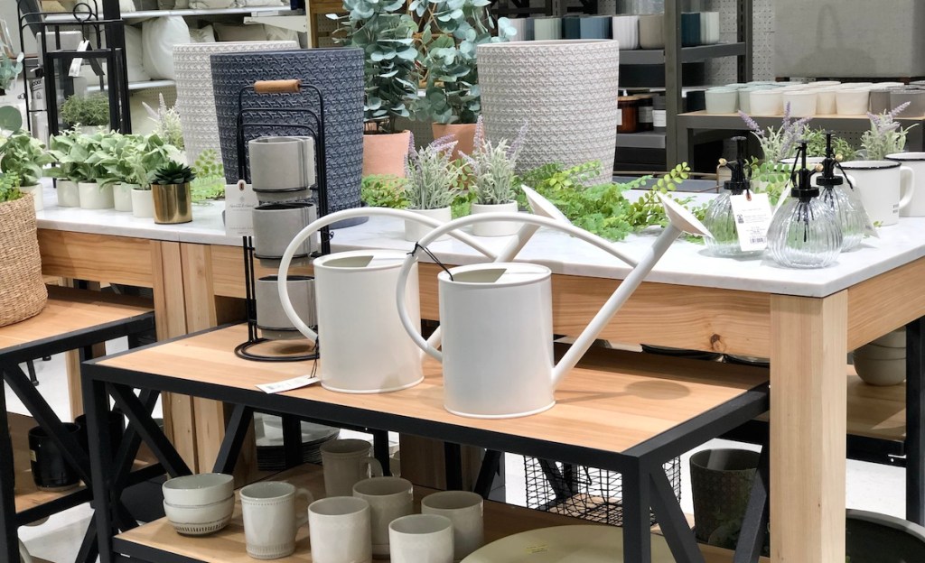 spring home decor essentials on wooden store shelves 