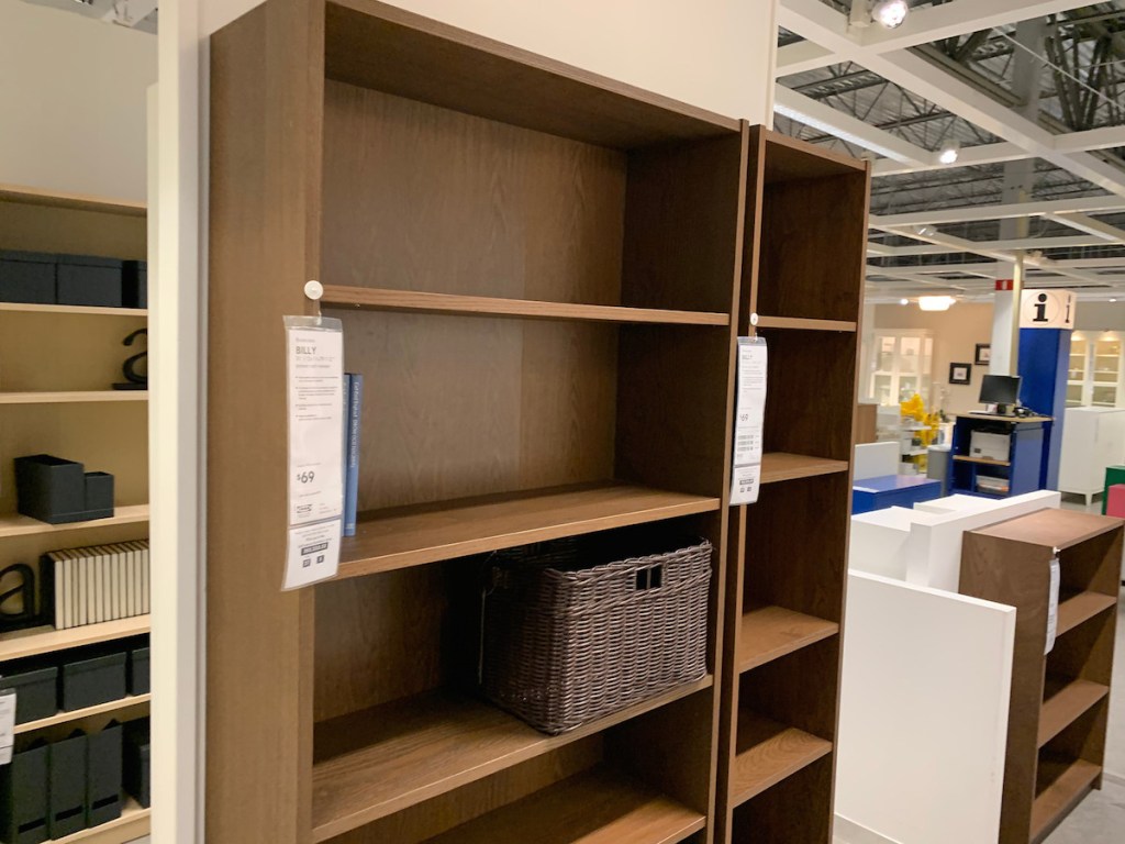 brown bookcases with one brown bin on it in store