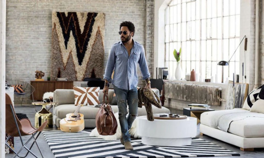 lenny kravitz walking in gorgeous well lit living room with furniture and decor