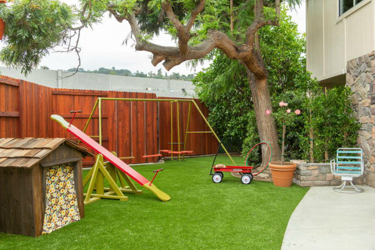Brady Bunch Backyard with playhouse and swingset