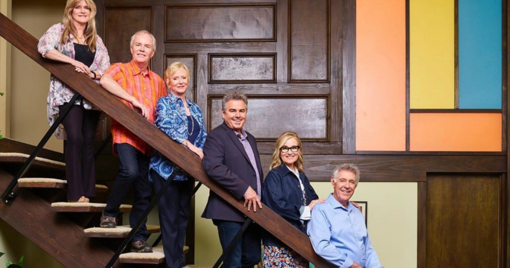 The Brady Bunch Crew standing on stairs