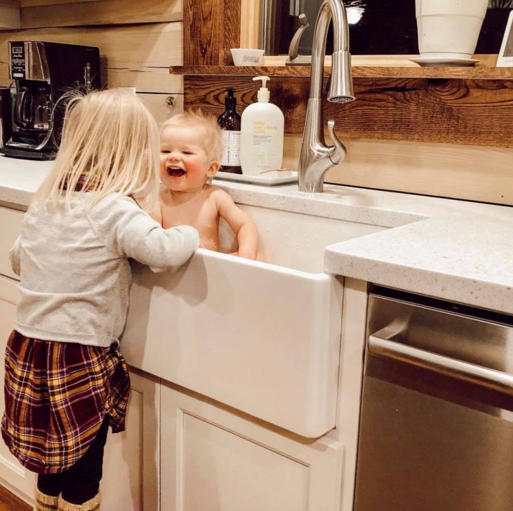 Washing baby in farmhouse sink 