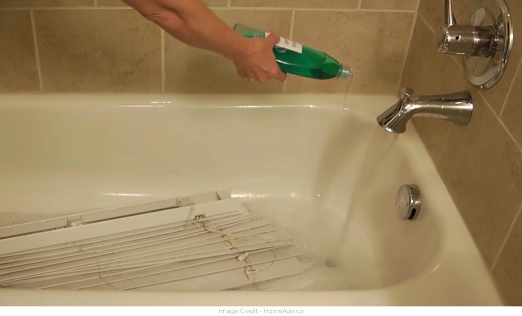 white blinds in bathtub with bubbles 