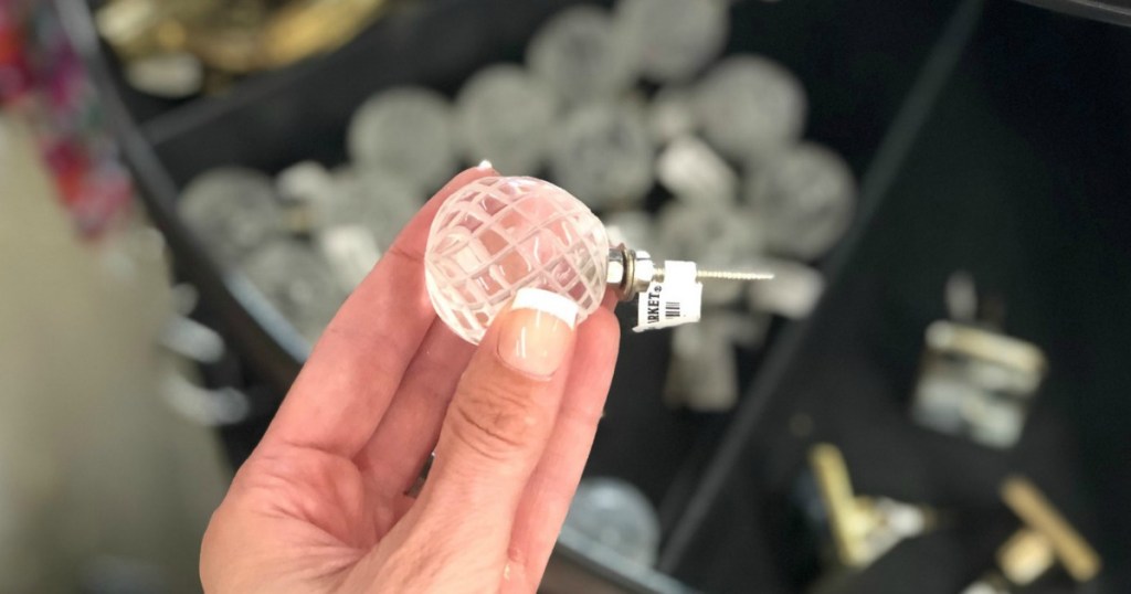 holding clear ball knob at World Market