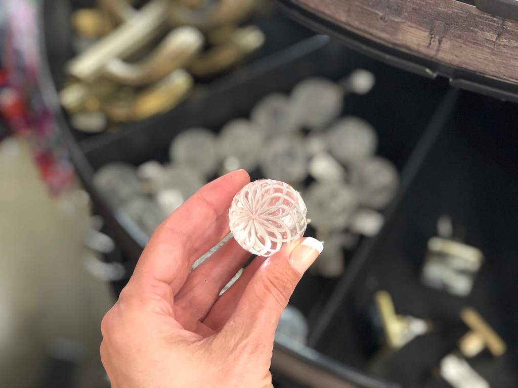 holding clear ball knob at World Market