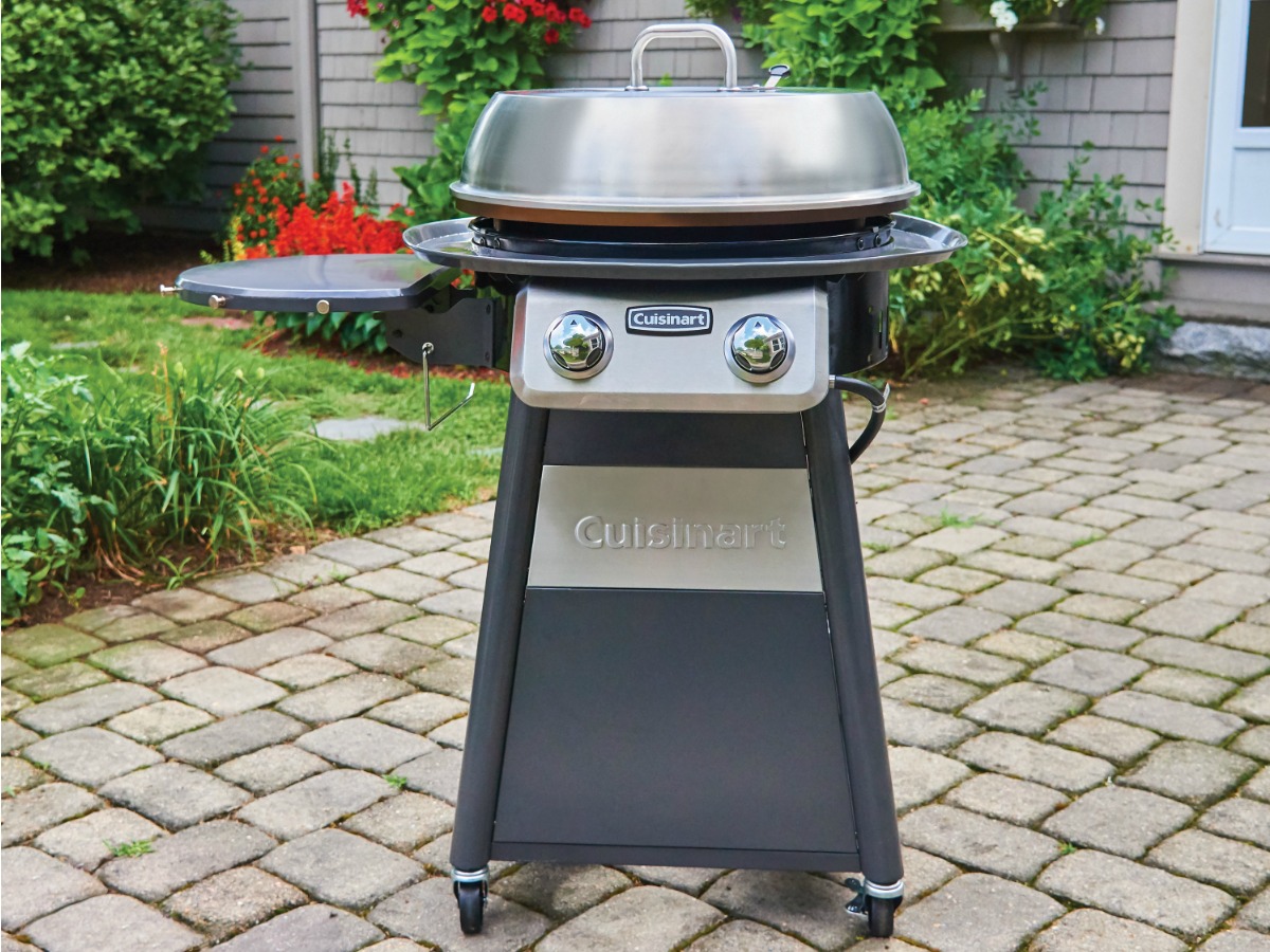 Cuisinart cooking center on a brick pathway outside of a house