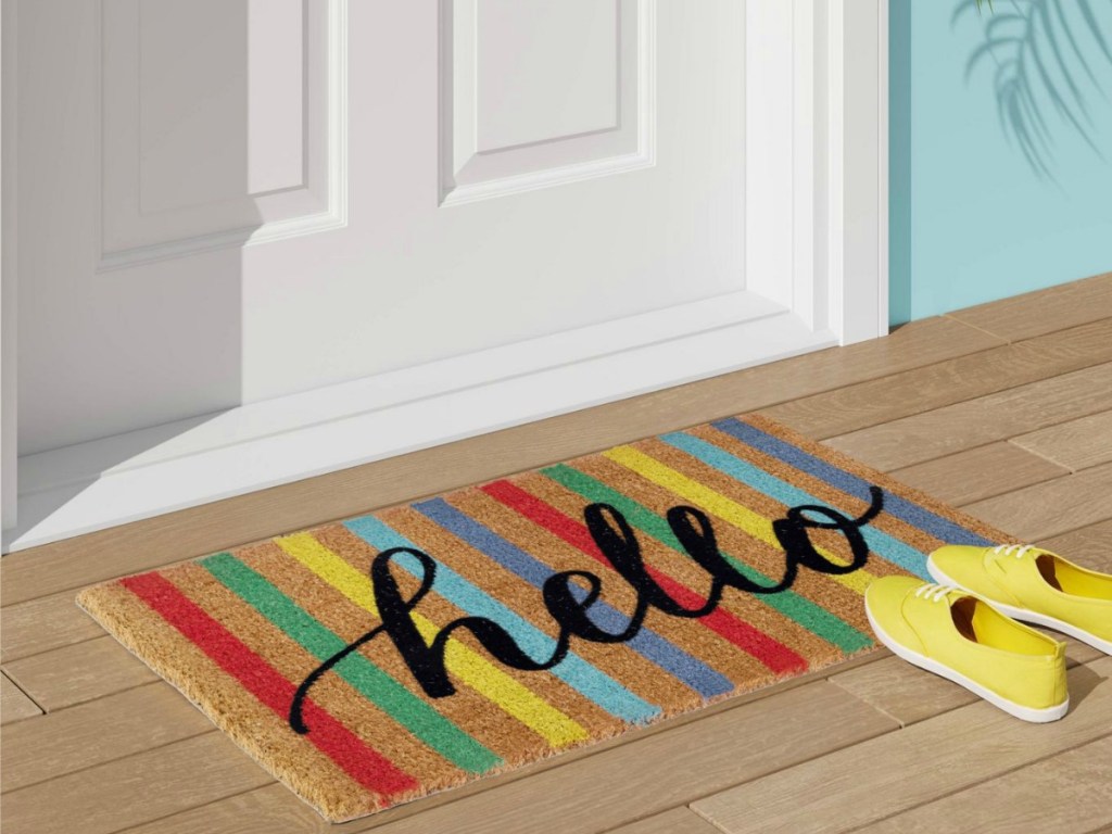 colorfully striped doormat with hello in script