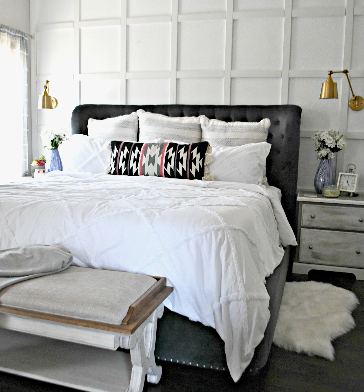 after photo of Lina's room makeover with white walls and white bedding 