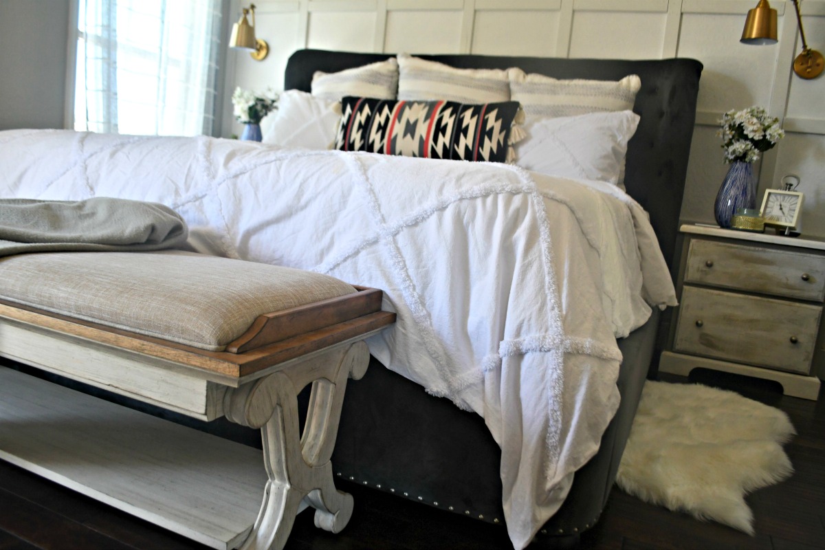farmhouse style bench at the end of bed 