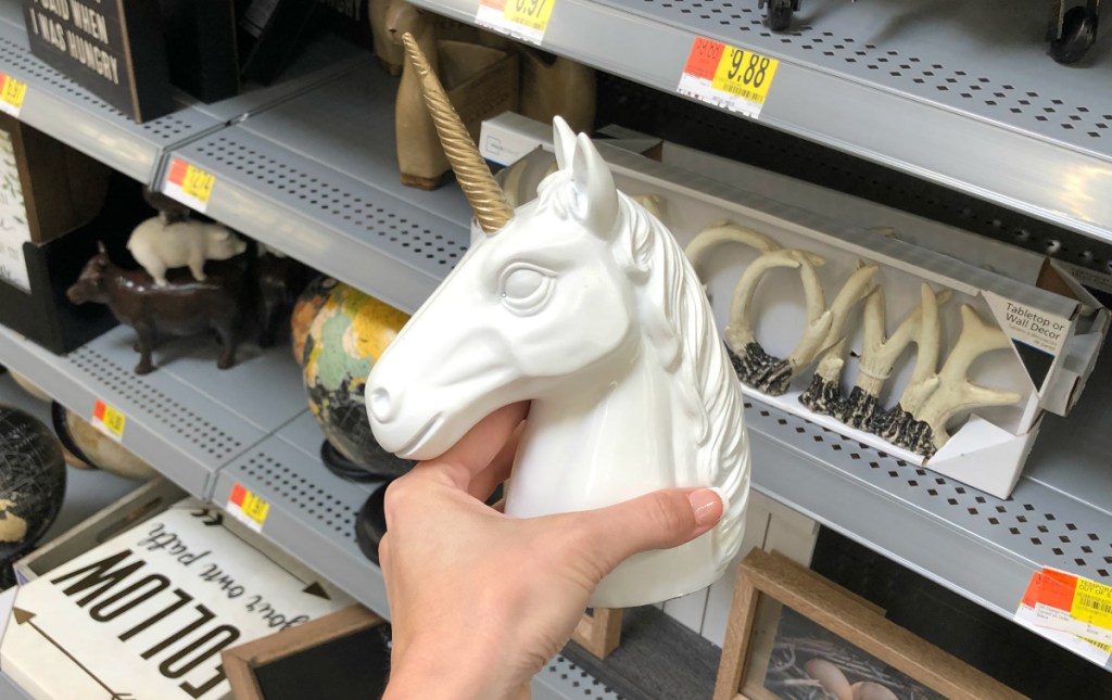 hand holding Mainstays Poly Unicorn Tabletop Decoration