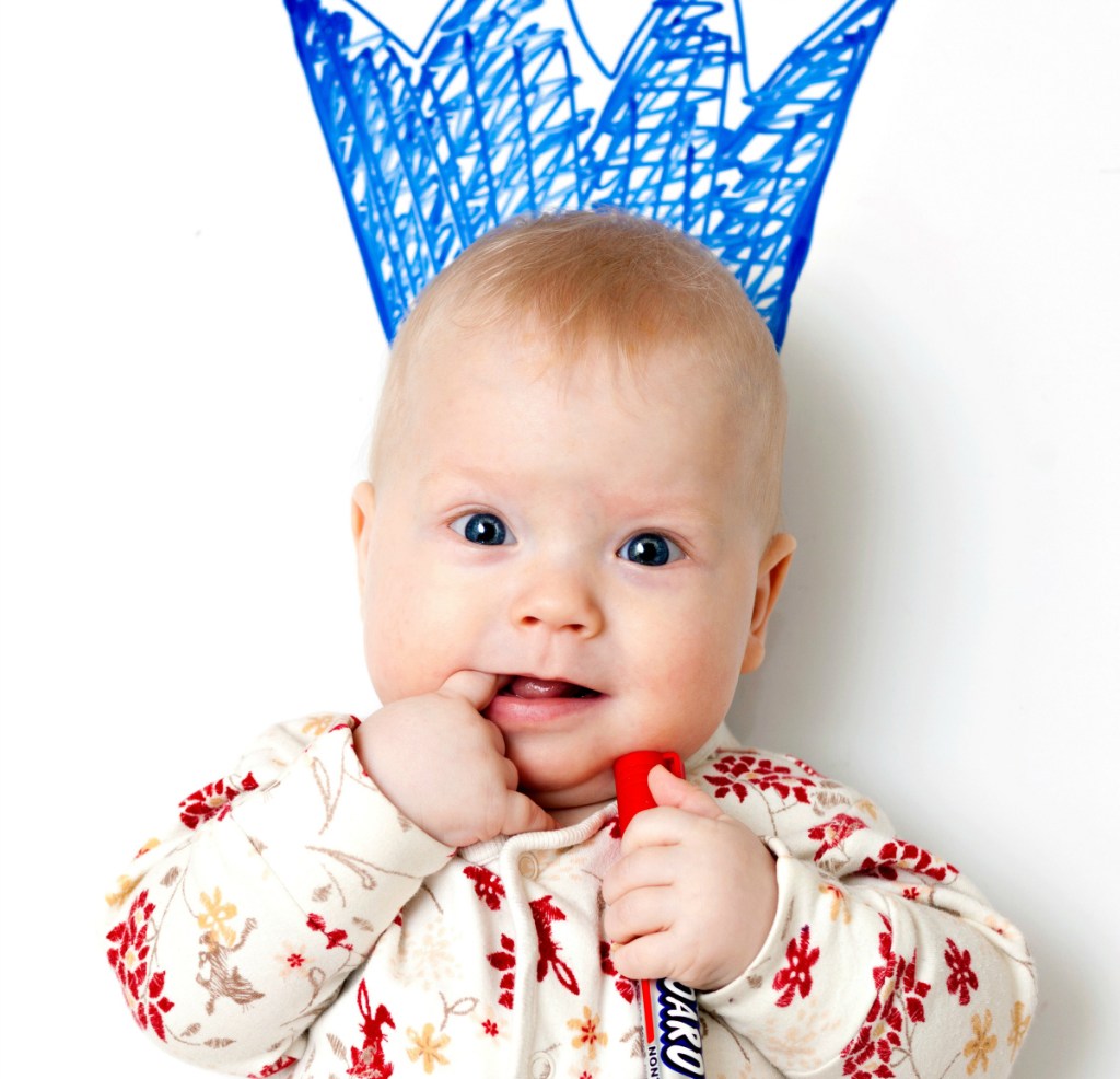 adorable baby writing on wall