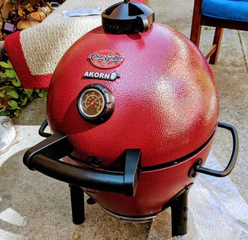 red egg shaped grill sitting outside