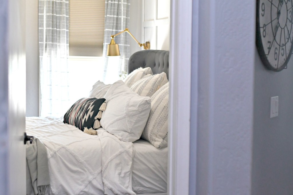 bright bedroom with gray and white decor 