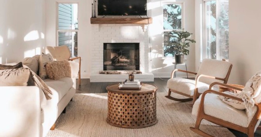 neutral living room with large jute rug and other white and brown furniture