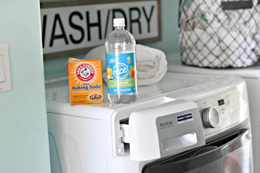 washing machine with baking powder and vinegar on top