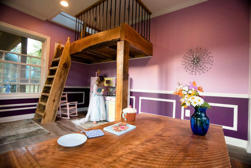 inside view of playhouse with girl playing