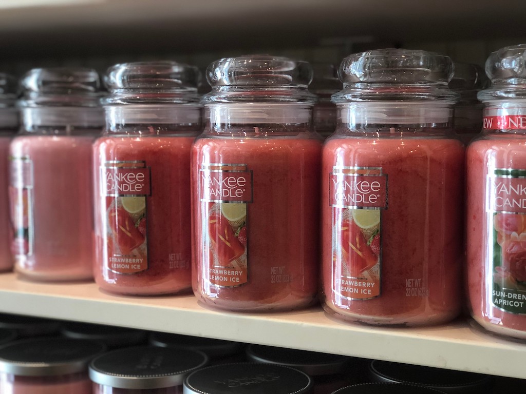 large jar yankee candles on shelf 