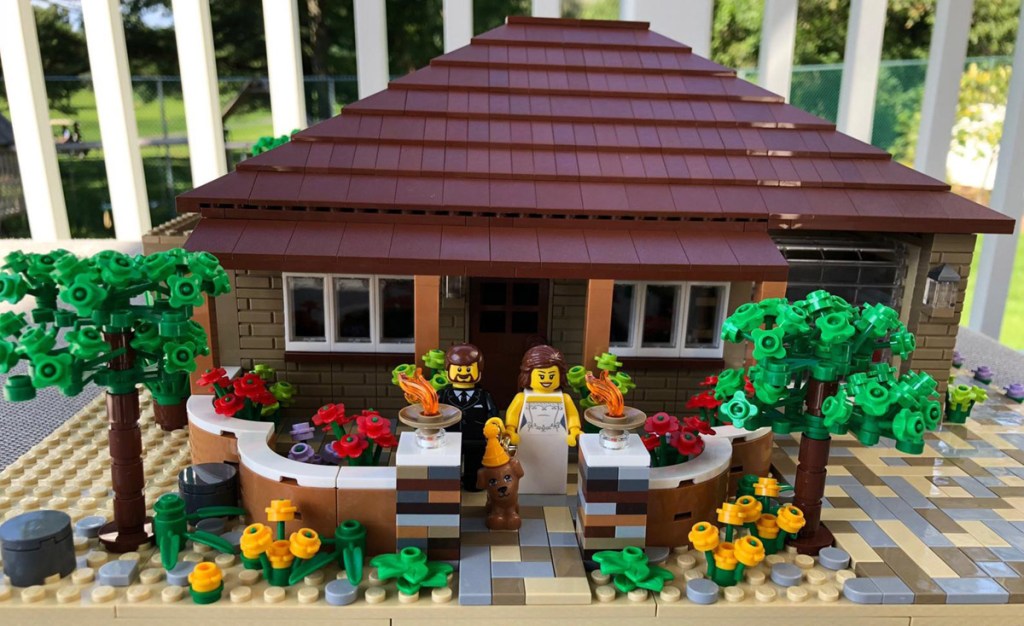 LEGO house with minifigure couple on porch