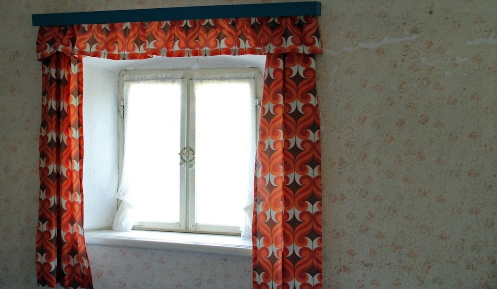 window with ugly red orange curtains