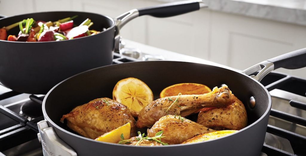Select by Calphalon cookware on stove cooking dinner 