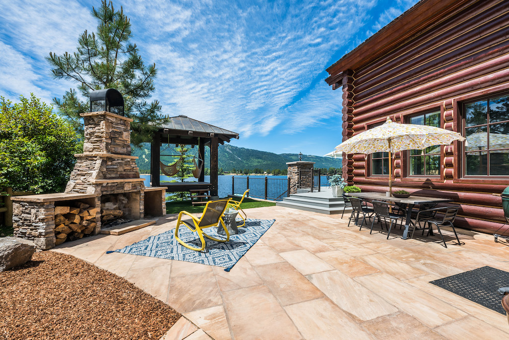 outdoor patio with firepit on lake 