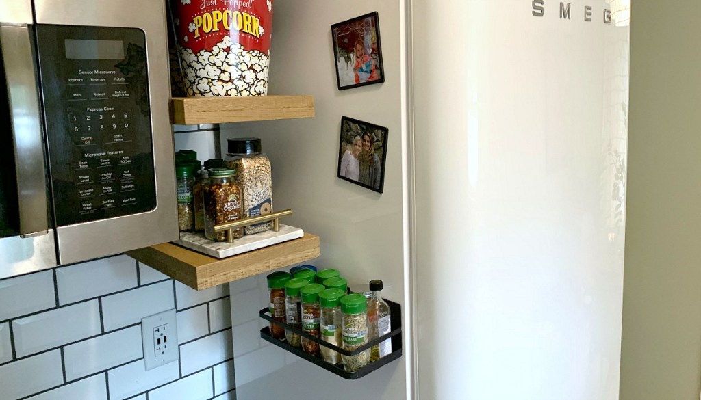 side of fridge holding spice rack organizer