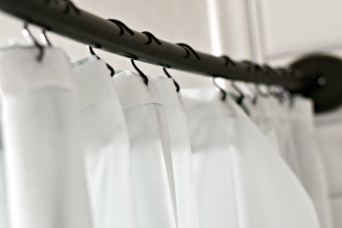 shower rod with shower rings and shower curtain liner 