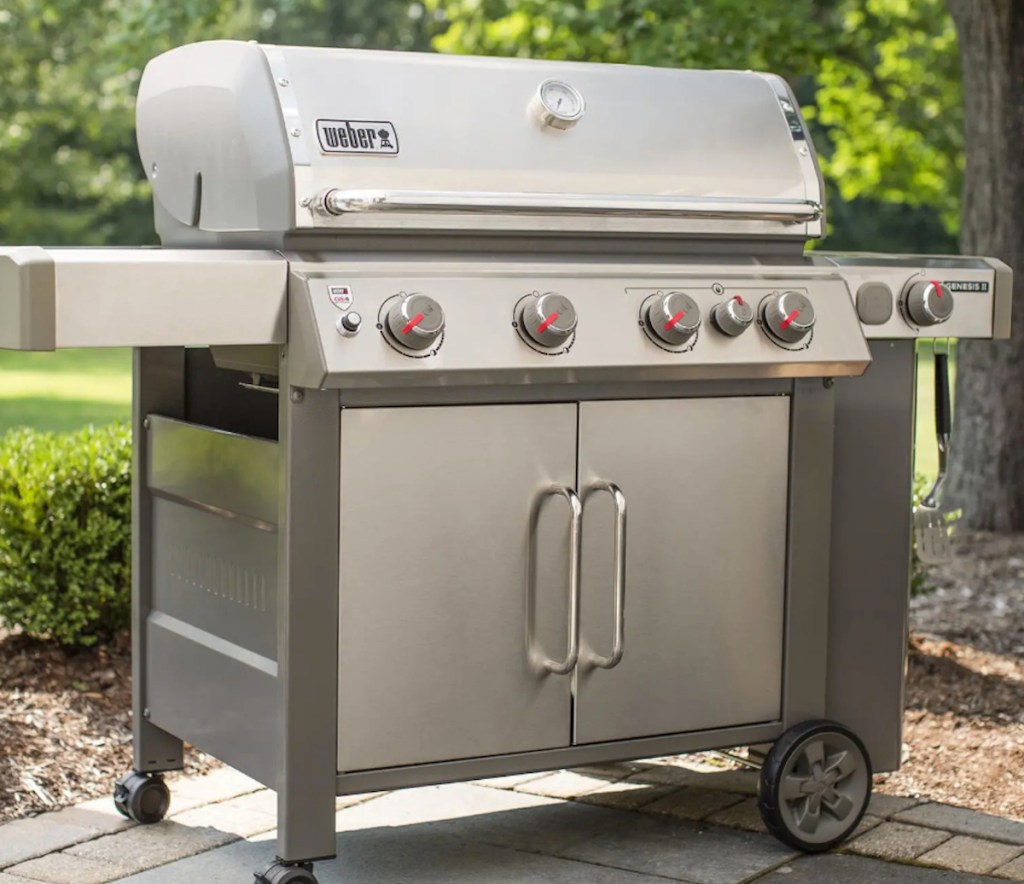 stainless steel weber grill sitting outside