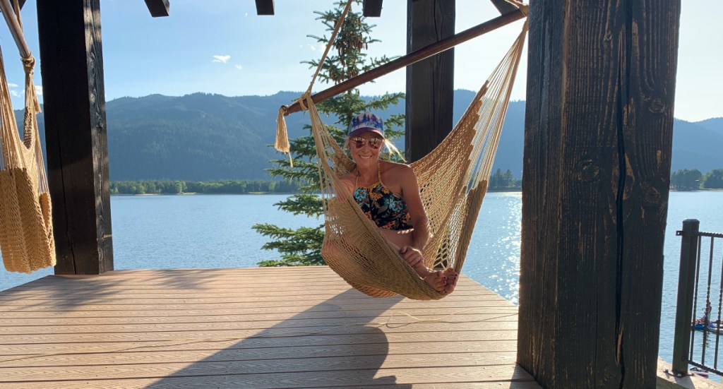 woman sitting in hammock chair