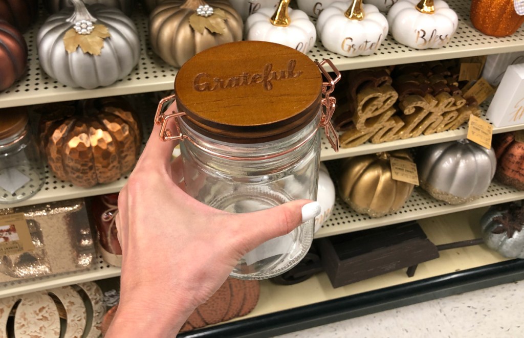 hand holding Grateful Flip Lid Canister