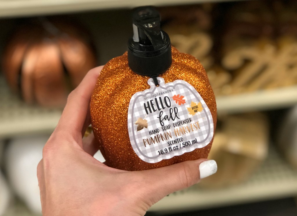 hand holding Hello Fall Pumpkin Soap Dispenser