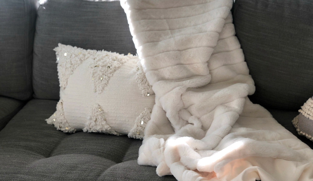 opalhouse cream fringe pillow on couch from target