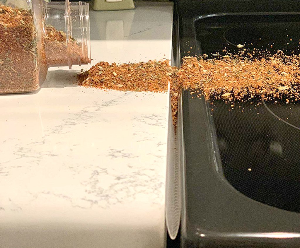 crumbs on counter next to stove
