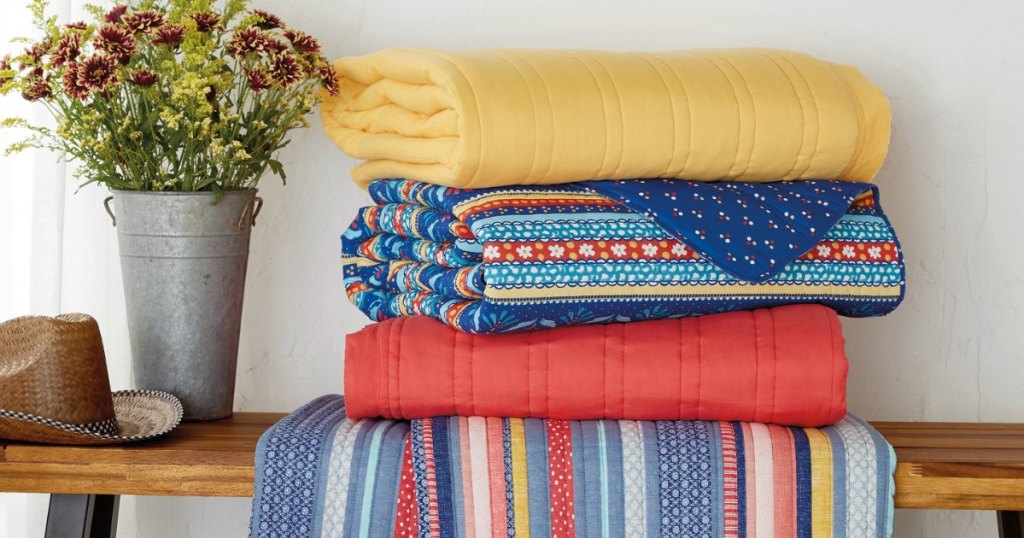 The Pioneer Woman Blankets folded on bench 