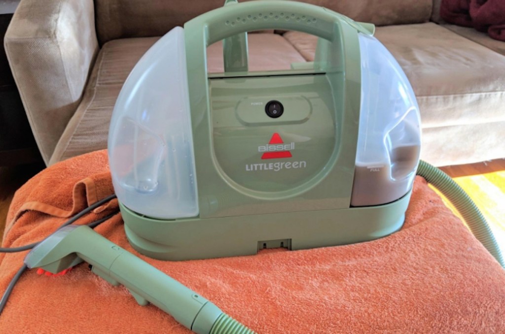 green bissell spot cleaner on orange towel