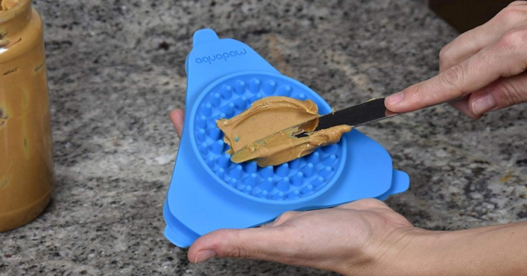 blue silicone triangle mat with peanut butter 