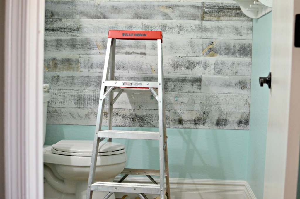 in progress installing wood plank wall